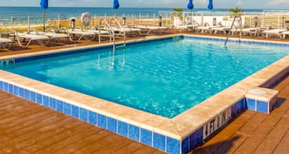 Beautiful & open home with enclosed porch, game room, W/D - beach & pool access