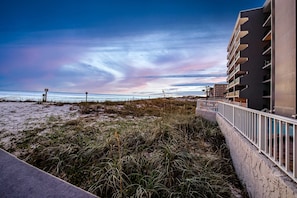 A coastal hotel with a view of the beach and ocean. - Bright, beachfront condo with beach service included - quick walk to dining (Fort Walton Beach)