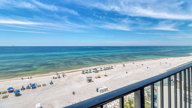 A beach with clear skies and calm waters. - Centrally located condo w/ private balcony, Pool & Hot tub (Panama City Beach)