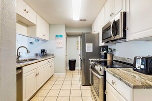 Fridge, microwave, oven, stovetop - Adorable condo across from the Gulf with central AC, deck, pool & grill (Perdido Key)