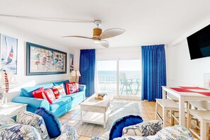 TV, offices - Charming oceanfront condo with open layout, balcony, pool, hot tub, & gym (Panama City Beach)