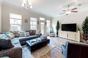 TV, offices - Dog-friendly beach house with balcony, fenced yard, & AC - walk to beach (Panama City Beach)