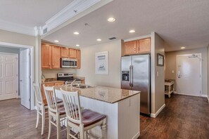 Fridge, microwave, oven, stovetop - Gulf-front condo with pier views, balcony, heated pool, gym & AC (Panama City Beach)