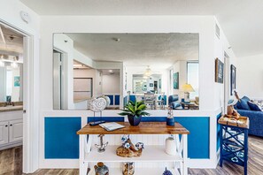 A modern kitchen with a wooden countertop, a potted plant, and decorative items. - Beachfront condo with Gulf-view balcony, on-site pools, & direct beach access (Panama City Beach)