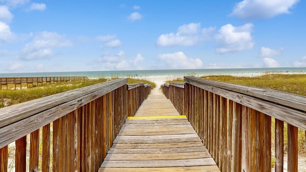 A wooden boardwalk leading to a beach with a clear sky. - Gorgeous coastal townhome with private balcony/porch, W/D, and shared pool (Pensacola)