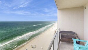 A balcony with a view of the beach and ocean. - Elegant condo w/ gulf-front views & on-site pools, hot tubs, beach service (Panama City Beach)