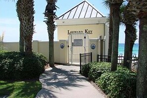 A gated entrance to a building with a sign reading "Leeward Key." - Gorgeous home a walk to the Gulf & minutes from dining (Miramar Beach)
