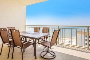 Outdoor dining - 12th-floor Gulf-front condo with amazing views, pools, gym & hot tub (Perdido Key)
