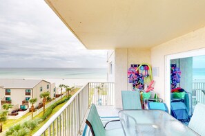 Outdoor dining - Beachfront condo with ocean-view balcony, pools, hot tub, gym, central AC, & W/D (Panama City Beach)