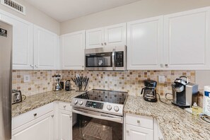 Fridge, microwave, oven, stovetop - Waterfront Gem - Shared Pool, Beach Access, Free WiFi, Washer/Dryer & Central AC (Fort Walton Beach)