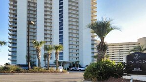 A multi-story hotel with a prominent sign reading "PALACIO 13661." - 13th-floor condo with amazing views, pools, gym & beach access (Perdido Key)