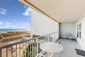 Outdoor dining - 2nd-floor, oceanfront condo with Gulf view, W&D, heated pool, & large balcony (Fort Walton Beach)