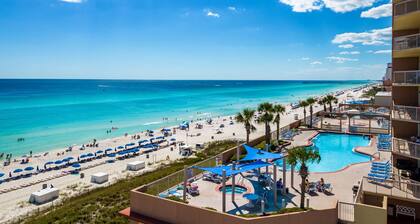 Elegant, beachfront condo with a furnished balcony, views & two pools