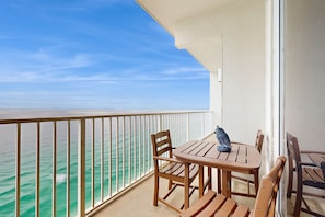 Outdoor dining - High-end retreat with balcony, sweeping Gulf views, pools & hot tubs (Panama City Beach)