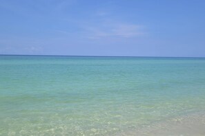 A clear view of a beach with turquoise water and a clear sky. - Dog-friendly vibrant home with jetted tub - 2 miles to beach (Panama City Beach)