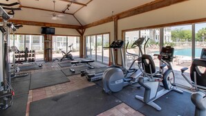 A gym with treadmills, elliptical machines, and weight equipment. - Blue Mountain Beach – charming 2nd floor condo with pool view (Santa Rosa Beach)