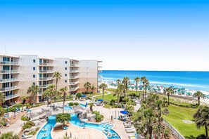 A hotel with a pool area, beach view, and multiple balconies. - Picturesque Beach-Front Condo At Waterscape Waterfall, Lazy River (Fort Walton Beach)