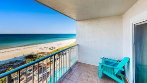 A balcony with a view of the beach and ocean. - Gulf-front condo with balcony, W/D, direct beach access, pools, hot tub & gym (Panama City Beach)