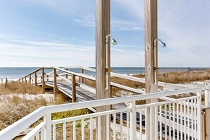 A wooden boardwalk leading to a beach with a clear view of the ocean. - Top-Floor, Gulf-Front Condo w/ Balcony, Beach Access & Shared Pools/Hot Tub/Gym (Perdido Key)