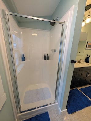 Shower, hair dryer, towels, soap