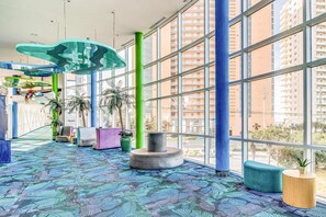 Interior - Colorful, beachfront condo with Gulf view, pool, hot tub, and lazy river (Panama City Beach)