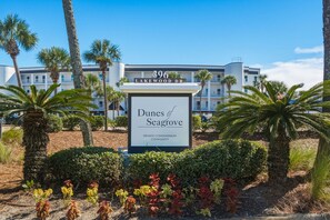 A sign for a private condominium community named 'Dunes of Seagrave' at 396 Lakewood Dr. - Beautiful 2nd-floor condo in Seagrove Beach with beach ambience & pickleball (Santa Rosa Beach)