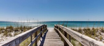 Modern beach condo with pool, hot tub, well-equipped kitchen, balcony, & W&D