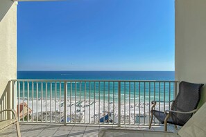 A balcony with a view of a beach and ocean. - Comfortable unit, Breathtaking views, Quick walk to dining (Miramar Beach)