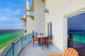 Outdoor dining - Updated beachfront retreat with hot tub, outdoor pool & balcony (Panama City Beach)