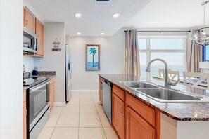 Fridge, microwave, oven, stovetop - Oceanfront, 7th-floor condo with pool, ocean view & high-speed WiFi (Panama City Beach)