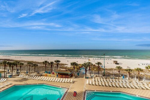 Cozy beachfront condo with private balcony, shared pool & beach access