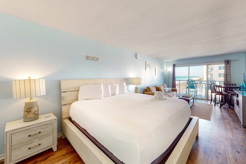 Sixth floor oceanfront condo with pool access, central AC, and sunset ocean view