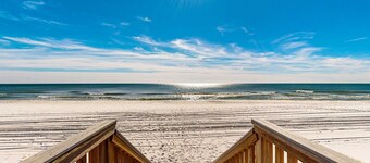 Sixth floor oceanfront condo with pool access, central AC, and sunset ocean view