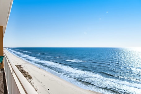 On the beach. Beachfront condo with amazing balcony views, pool & complimentary beach chairs