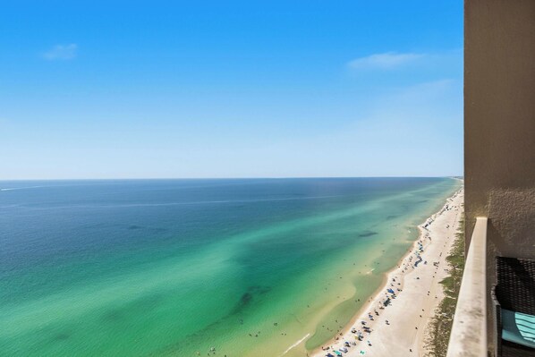 A coastal view with a beach and ocean. - Tropical, Gulf front condo w/ a private balcony, shared pool, & hot tub (Panama City Beach)