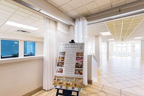A hotel event venue with a sign listing services like weddings, receptions, and conferences. - Gulf front condo with free WiFi, washer&dryer, shared pool, & beach access (Fort Walton Beach)