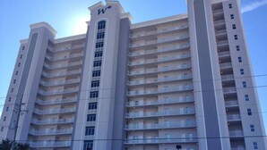 A multi-story hotel with a prominent 'W' logo on the facade, featuring balconies on each floor. - Inviting Gulf-front condo In Perdido Key with waterfront pool/hot tub and oceanfront balcony (Perdido Key)