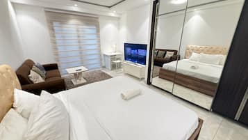 Luxury Apartment, City View | Iron/ironing board, free WiFi