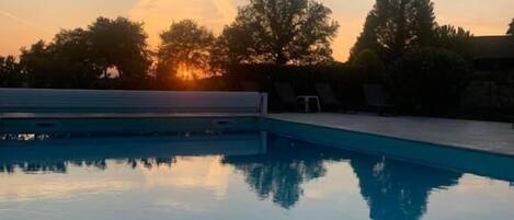 Seasonal outdoor pool, open 9:00 AM to 7:00 PM, free pool cabanas