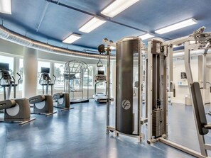 A modern gym with various exercise equipment, large windows, and a clean, well-lit interior. - 4th Floor Condo At Waterscape Children's Playground, 2 Hot Tubs (Fort Walton Beach)