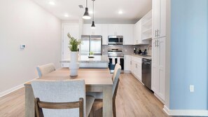 Fridge, dining tables - Landing | Stylish 2BD, Yoga Studio, Gym (Four Corners)