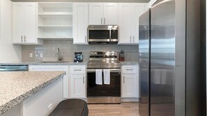 Fridge, dining tables - Landing | Modern 1BD, Yoga Studio, Gym (Four Corners)