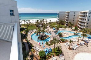 A resort with a pool area, beach, and ocean view. - Inviting, Spacious Condo On Okaloosa Island Waterfall, Lazy River (Fort Walton Beach)
