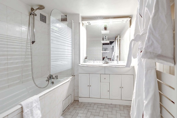 The bathroom is accessible via the hallway