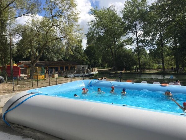 Seasonal outdoor pool, open 10:00 AM to 6:00 PM, pool loungers