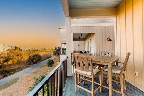 Pristine waterfront escape just steps to beach with community pool, washer dryer