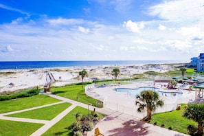 A resort with a pool, beach access, and a view of the ocean. - Spacious Oceanfront Home w Open Deck, Free WiFi & Amazing Views (Fort Morgan)
