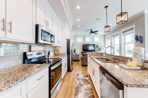 Fridge, microwave, oven, stovetop - Coastal, group-friendly getaway with outdoor pool access and fishing pier (Gulf Shores)