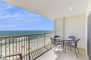 Outdoor dining - Gulf front condo with community outdoor and indoor pools, hot tub, and sauna (Gulf Shores)