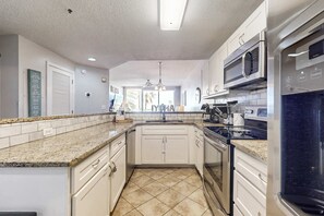 Fridge, microwave, oven, stovetop - Gulf View Condo w Balcony & Resort Pool Tennis Sauna Gym (Gulf Shores)